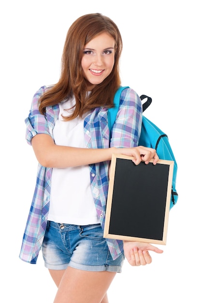 Beautiful teen girl with small blackboard and backpack isolated on white background back to school concept