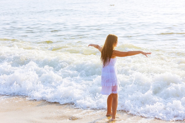 Beautiful teenage girl on the ocean