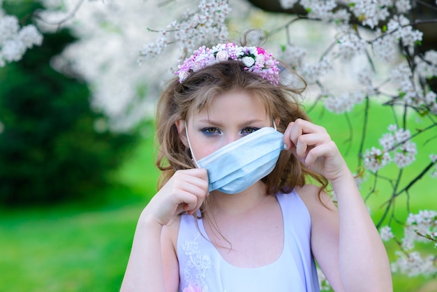 Beautiful teenage girl wearing a protective mask