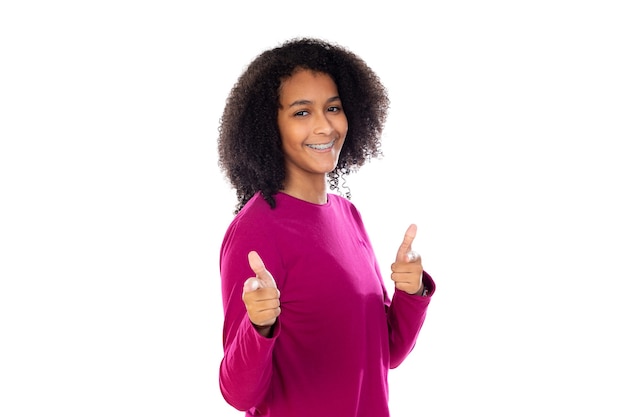 Beautiful teenager girl with pink sweater isolated on a white wall