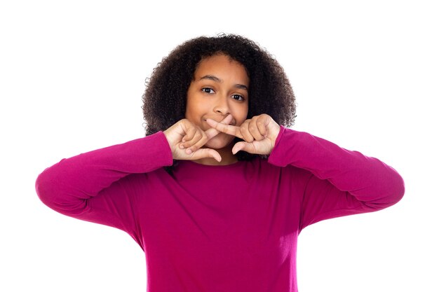 Beautiful teenager girl with pink sweater isolated on a white wall