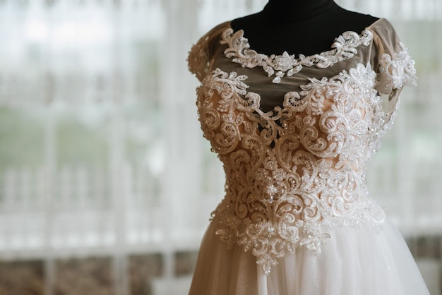 Beautiful tender wedding dress on wedding day close up