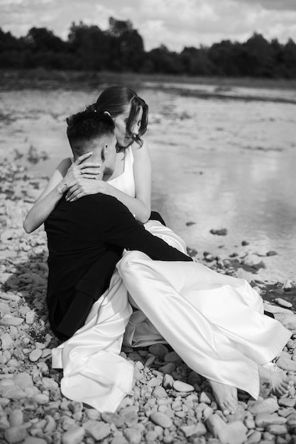 Beautiful tender young groom and wife Black and white photo