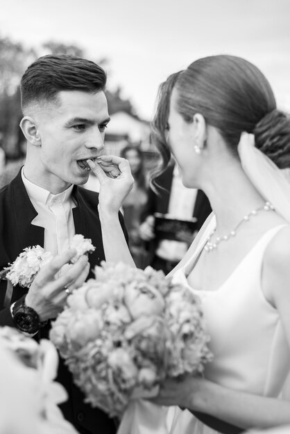 Beautiful tender young groom and wife Black and white photo