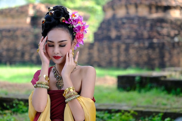 Beautiful Thai girl in traditional dress costume in Choeng 