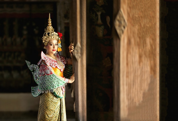 Beautiful Thai young woman portrait in Kinnaree traditional dress costume