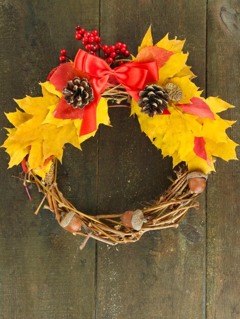 Beautiful Thanksgiving wreath on wooden background