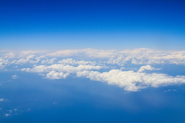 Beautiful thick clouds in the sky from the height of the plane