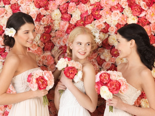 beautiful three women with background full of roses