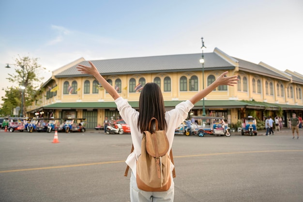 Beautiful tourist woman on vacation sightseeing and exploring Bangkok city Thailand