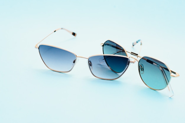 Beautiful trendly sunglasses on a Classic Blue Pantone color of the year background