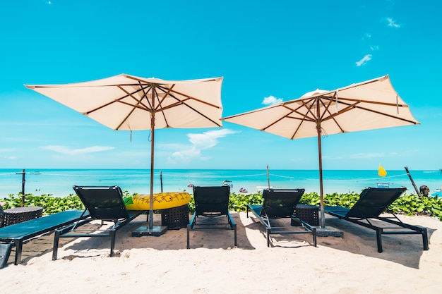 Beautiful tropical beach and sea with chair on blue sky