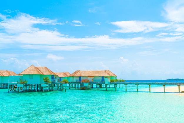 Beautiful tropical Maldives resort hotel and island with beach and sea - holiday vacation concept