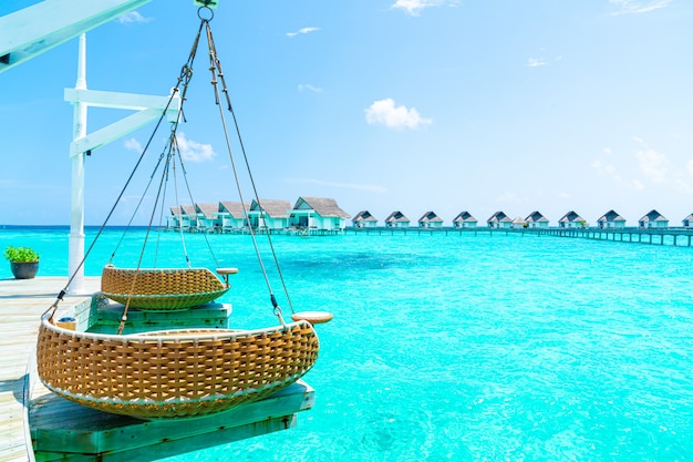 Beautiful tropical Maldives resort hotel and island with beach and sea