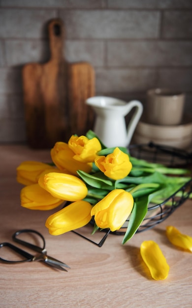 Beautiful tulip flowers on table at kitchen