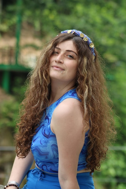 A beautiful Turkish girl dressed in the local dress portrait of happy and cheerful woman