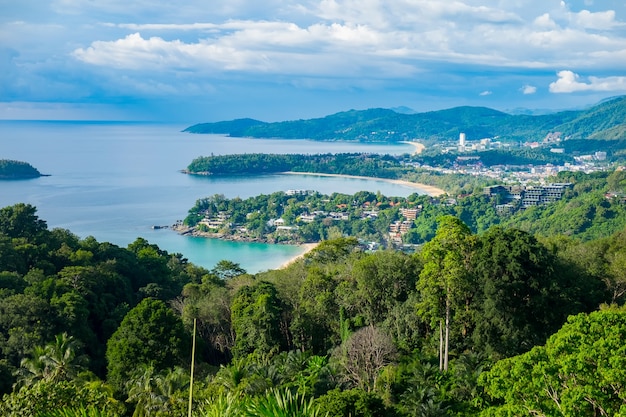 Beautiful turquoise ocean waives with boats and sandy coastline from high view point. Kata and Karon beaches, Phuket, Thailand