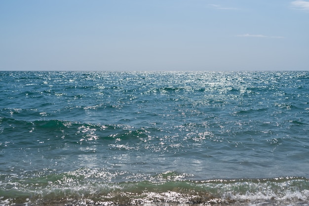 Beautiful turquoise sea with small waves on a bright Sunny day