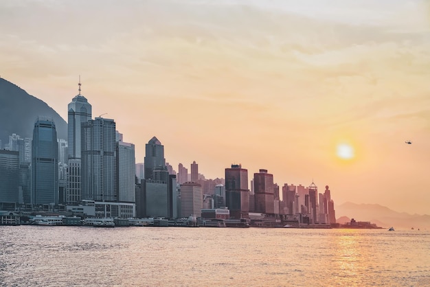 Beautiful Victoria Harbor of Hong Kong at sunset. View from Kowloon on HK Island.