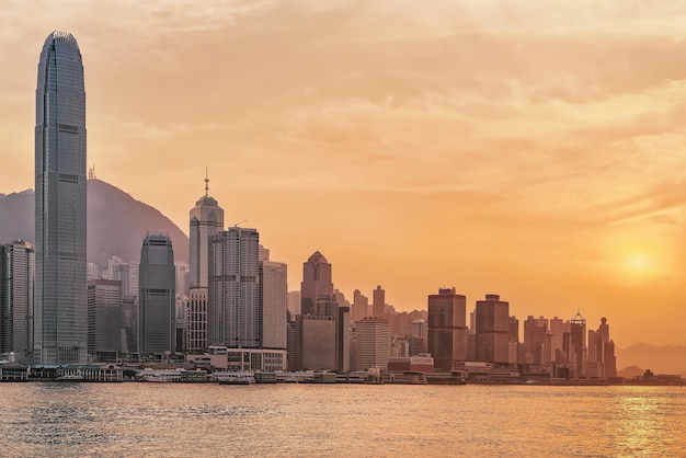 Beautiful Victoria Harbor in Hong Kong at sunset. View from Kowloon on HK Island.