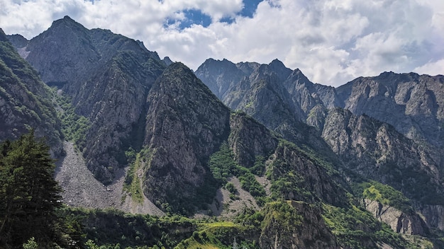 Beautiful view of big mountains under cloudy sky