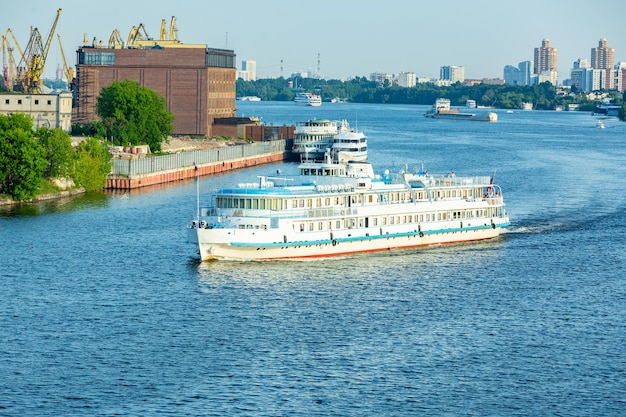 Beautiful view of the city the river and ships River excursion boat trips