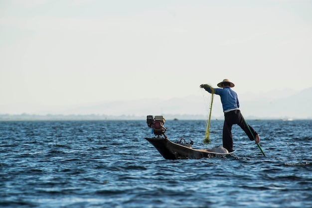 Photo a beautiful view of fisherman in inle lake myanmar