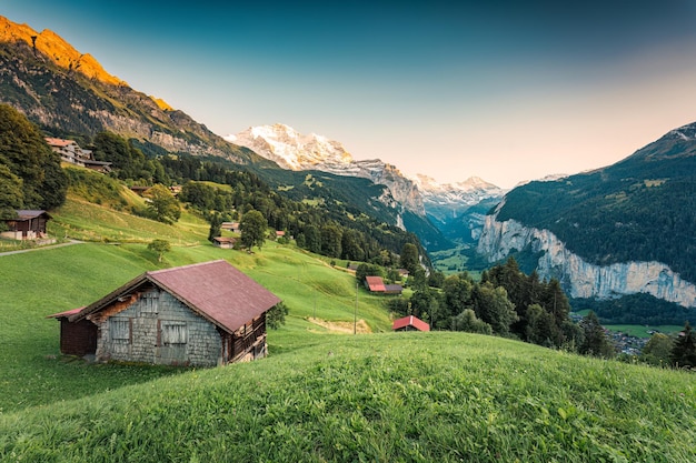 Beautiful view from Wengen mountain village and Lauterbrunnen valley with Jungfrau mountain in the evening at Bern Switzerland