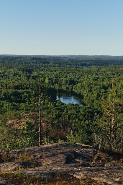 Beautiful view of lake from top of Hiidenvuori mountain in Finnish village of Hiidenselga Karelia