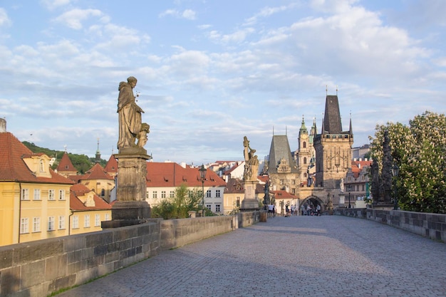 Beautiful view of the Malostranska tower of Charles Bridge at dawn in Prague Czech Republic