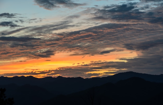 Beautiful view of mountain landscape with dramatic sunset sky