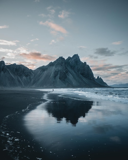 Beautiful view of rocky mountains reflecting in a lake in Iceland