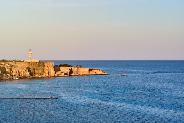 Beautiful view of sea cost against blue sky