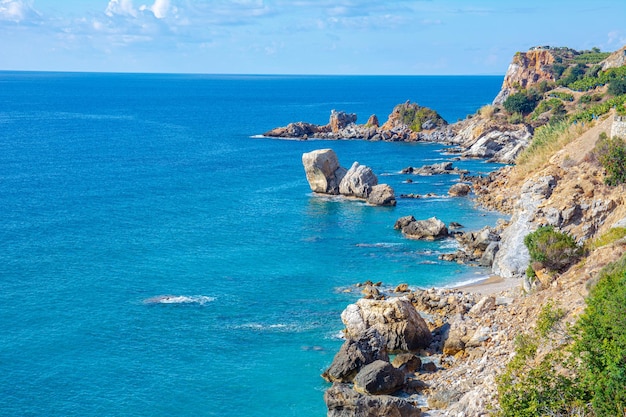 Beautiful view of the sea and rocky steep coast with banana trees