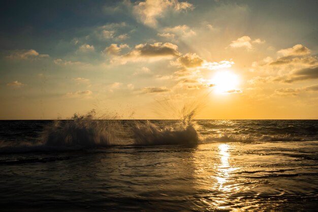 Beautiful view of the sea with the sun shining in a blue sky in the background