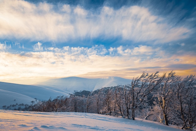 Beautiful view of the ski slope on a sunny winter evening, concept of relaxation in clean European ski resorts