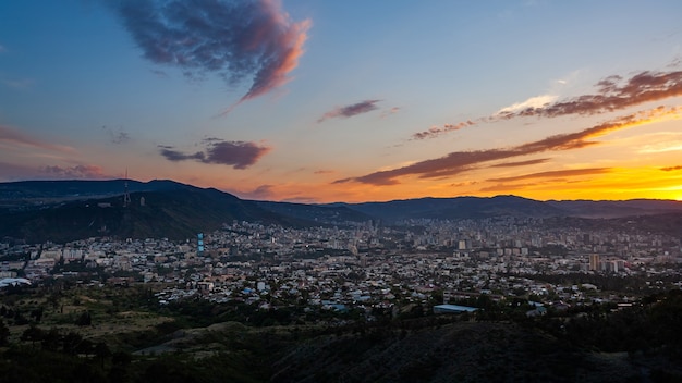 Beautiful view of Tbilisi at sunset, capital of Georgia. Citiyscape