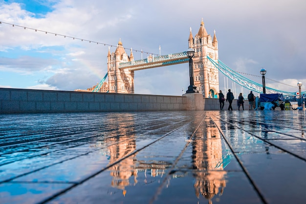 Beautiful view of the Tower bridge in London with a full rainbow over the Tower of London castle.