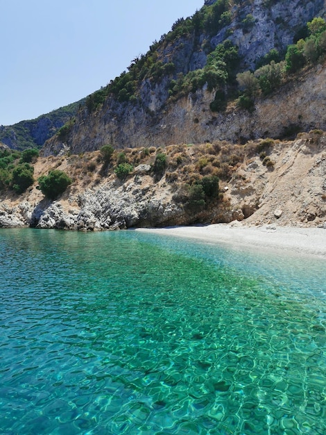 Beautiful views of the azure coast rocks pine trees and white sand The Aegean sea Turkey Kusadasi