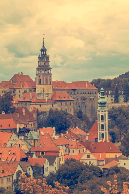 Beautiful views of the old town with a castle church and houses with red tile roofs Toned