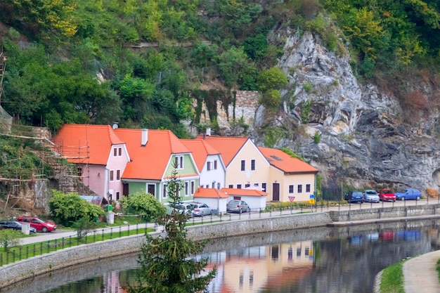 Beautiful views of the old town with river bridge and houses with red tile roofs Toned