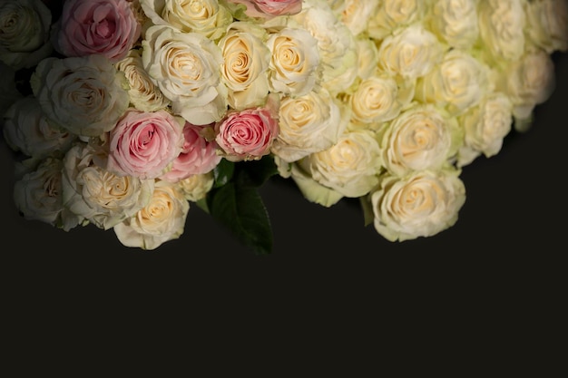 Beautiful vintage bouquet of white roses on a dark background