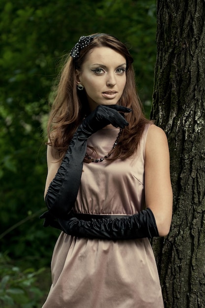 Beautiful vintage woman in summer park