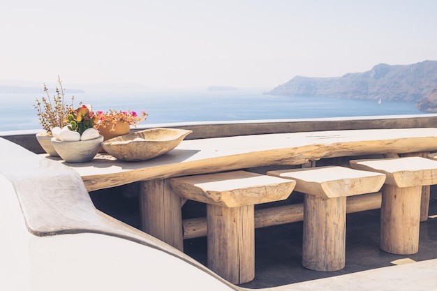 Beautiful vintage wooden table and chairs on terrace Santorini