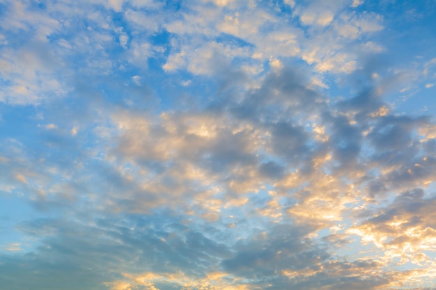 Beautiful Vivid sky painted by the sun leaving bright golden shadesDense clouds