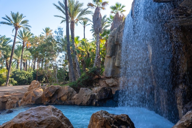 Beautiful waterfall in the El Palmeral park in the city of Alicante