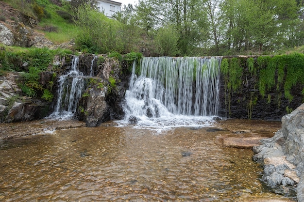 A beautiful waterfall on the natural swimming pool in Arrago river in the town of Descargarmaria, Spain