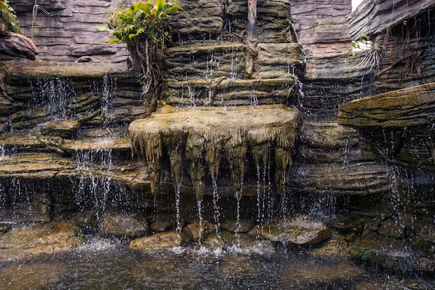 Beautiful waterfall that flows along the rocks.