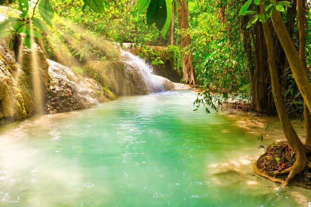 Beautiful waterfall in wild rainforest in Erawan National park Thailand