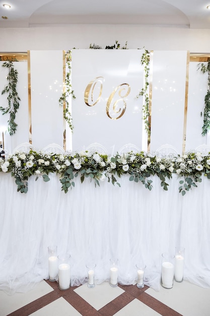 Beautiful wedding arch of flowers for the newlyweds Decoration on a holiday